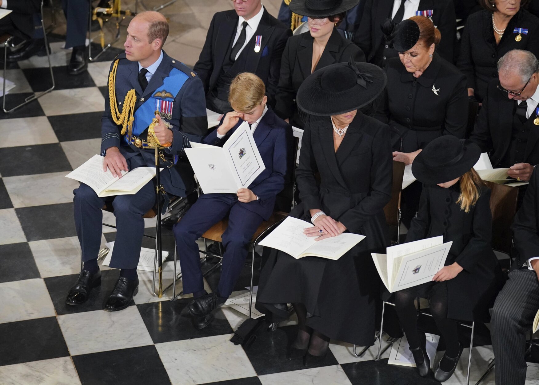 From left, Prince Charles, Prince George, Catherine, the Princess of Wales and Princess Charlotte attend the funeral service of Queen Elizabeth II at Westminster Abbey in central London, Monday Sept. 19, 2022. The Queen, who died aged 96 on Sept. 8, will be buried at Windsor alongside her late husband, Prince Philip, who died last year. (Dominic Lipinski/Pool via AP)