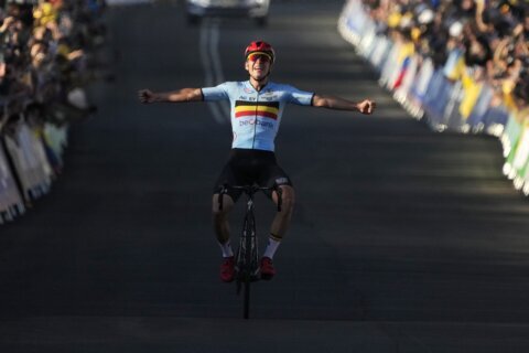 Evenepoel powers to road race gold at cycling worlds
