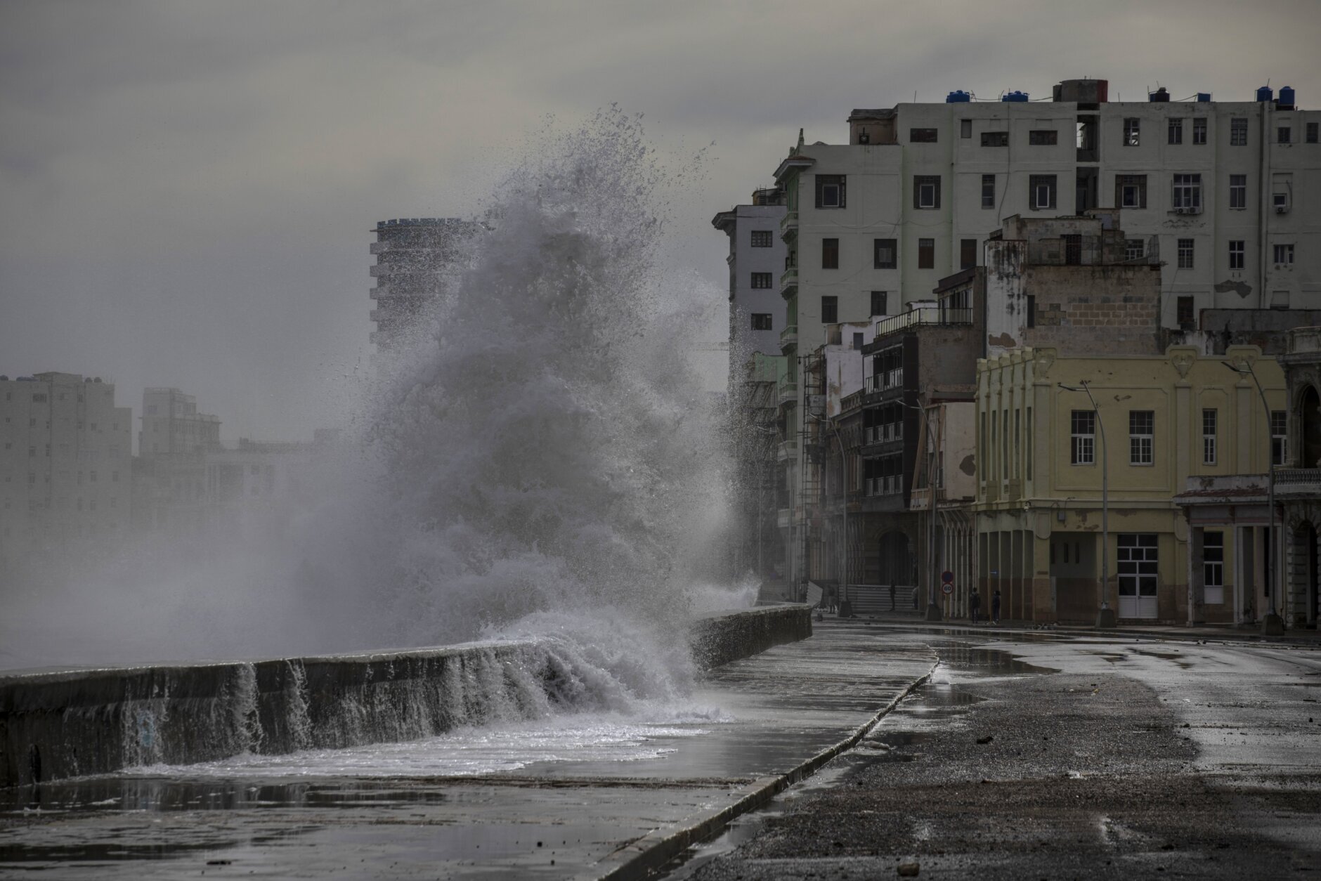 Huge waves crash against a seawall in the wake of Hurricane Ian in Havana, Cuba, Wednesday, Sept. 28, 2022. Cuba remained in the dark early Wednesday after Ian knocked out its power grid and devastated some of the country's most important tobacco farms when it hit the island's western tip as a major storm. (AP Photo/Ramon Espinosa)