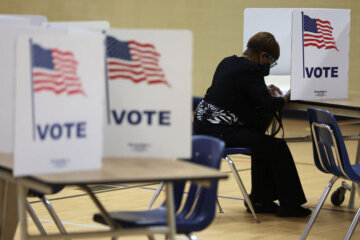 ALEXANDRIA, VIRGINIA - JUNE 21: A voter casts her ballot at a polling station at Rose Hill Elementary School during the midterm primary election on June 21, 2022 in Alexandria, Virginia. In two of the most competitive districts in the U.S., Virginians will be choosing Republican nominees to take on Democratic incumbents Rep. Elaine Luria (D-VA) and Rep. Abigail Spanberger (D-VA). (Photo by Alex Wong/Getty Images)