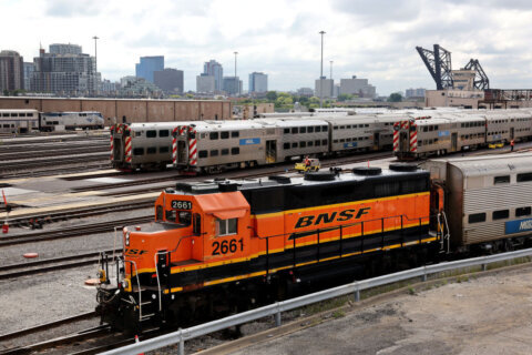 High-stakes talks between railroad and union officials in Washington push into the evening hours with strike days away