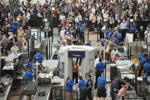 Holiday air travel tops pre-pandemic levels for the 1st time
