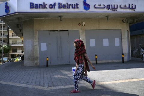 Lebanon retirees scuffle with police; banks partially reopen
