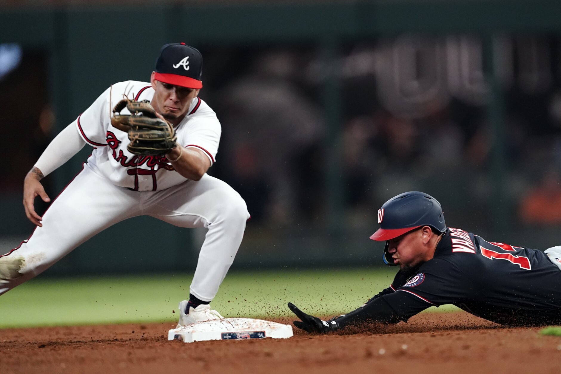 WASHINGTON, DC - SEPTEMBER 21: Atlanta Braves first baseman Matt Olsen (28)  connects for a home run during the Atlanta Braves versus Washington  Nationals MLB game at Nationals Park on September 21