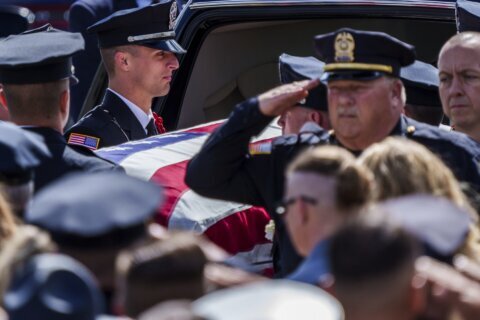 Slain Indiana officer’s fiancée recalls her life at funeral