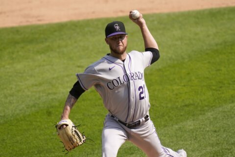 Freeland leads Rockies to 1-0 win over Nats in home opener
