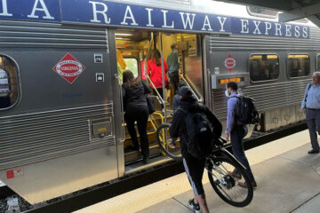 Passengers get on VRE train