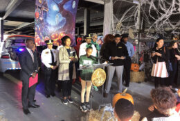 Ava Rogers, a 5th grader from Marie Reed Elementary, introduces Mayor Bowser at the Halloween Safety news conference. (WTOP/Kristi King)