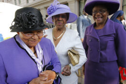 In this April 27, 2010, file photo milliner Vanilla P. Beane, 90, left, talks about her friendship with the late Dorothy Height, the leading female voice of the 1960s civil rights movement, outside the National Council of Negro Women building in Washington, where Height's casket arrived for public viewing.  When Height died at age 98 this spring, some of her friends and admirers wore hats to her funeral as a final tribute, Beane among them. And many of the women also wore purple, Height's favorite color.  (AP Photo/J. Scott Applewhite, File)
