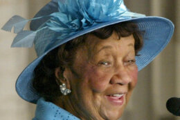In this March 24, 2004, file photo civil rights advocate Dorothy Height, wearing one of her signature hats created by Washington milliner Vanilla Beane, is applauded after receiving the Congressional Gold Medal during a ceremony at the Capitol Rotunda in Washington. (AP Photo/Charles Dharapak, File)