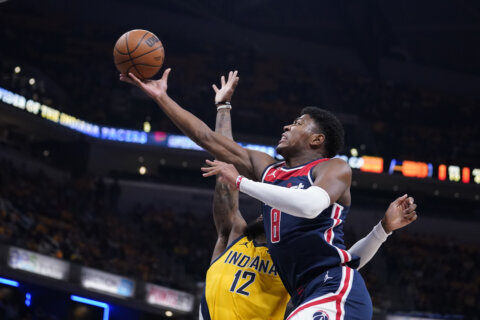 Beal, Wizards open season with 114-107 win over Pacers