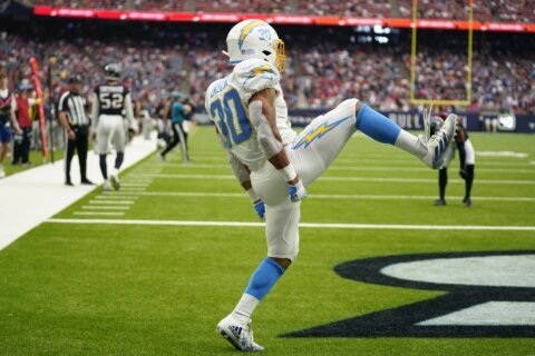 Ekeler scores 3 touchdowns, Chargers hold off Texans 34-24