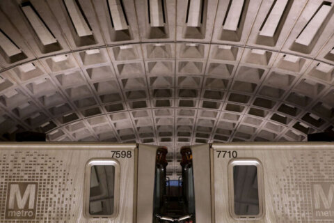 Metro train with 50 on board derails outside Reagan National airport, no reported injuries