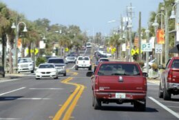 Motorists drive along a section of Panama City, Fla., Tuesday, Oct. 11, 2022, four years after the Panhandle city was heavily damaged by Hurricane Michael in 2018. Officials from the city are advising leaders in southwest Florida after that region was badly damaged by Hurricane Ian. (AP Photo/Jay Reeves)
