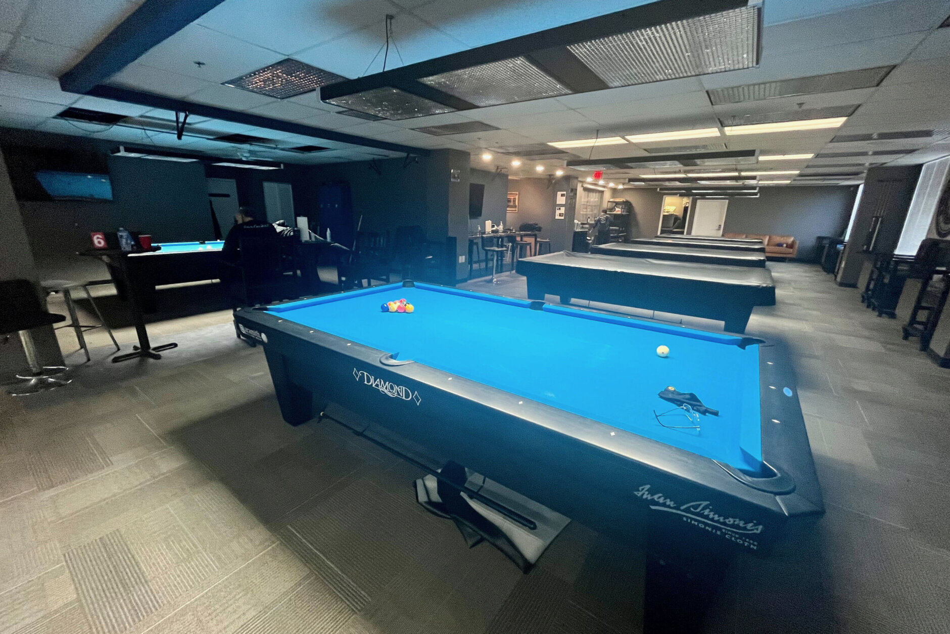 It looks like a typical office building along South Whiting Street in Alexandria, Virginia, but inside is a secret pool hall where the world's top players come to practice.