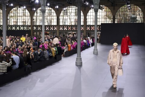 Glitzy Valentino show sees Paris Fashion Week at fever pitch