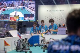 The Ukraine team, Danylo, Zakhar, Artem, from left to right, compete during the 6th edition of the First Global Robotics Challenge in Geneva, Switzerland, Saturday, Oct. 15, 2022. (Martial Trezzini/Keystone via AP)