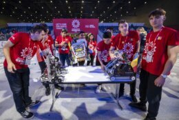 Teams from different countries present their robots before the competition, during the 6th edition of the First Global Robotics Challenge in Geneva, Switzerland, Saturday, Oct. 15, 2022. (Martial Trezzini/Keystone via AP)