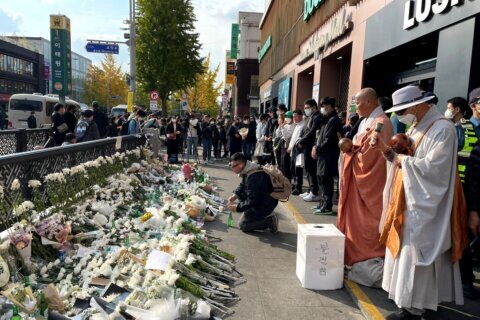 South Korean authorities say they had no guidelines for Halloween crowds, as families grieve 156 victims