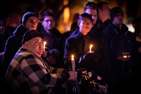 PHOTOS: Candlelight vigil held in DC for Colorado shooting victims