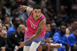 Washington Wizards forward Kyle Kuzma gestures after making a three-point shot in the second half of an NBA basketball game against the Dallas Mavericks, Thursday, Nov. 10, 2022, in Washington. Washington won 113-105. (AP Photo/Patrick Semansky)