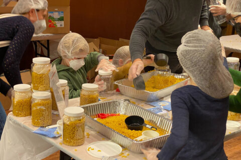Kids and parents prepare Thanksgiving meals for DC’s food insecure, homeless