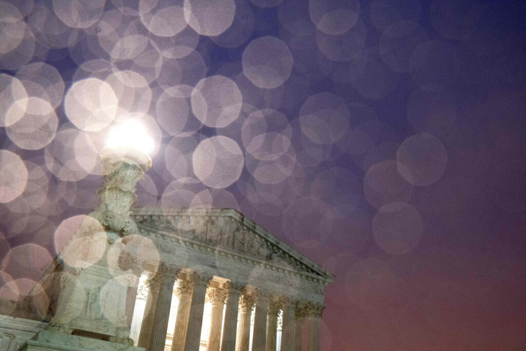 The US Supreme Court is seen past raindrops in Washington, DC