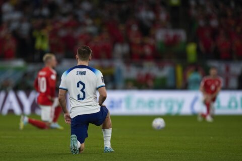 England and Wales players take a knee in World Cup match