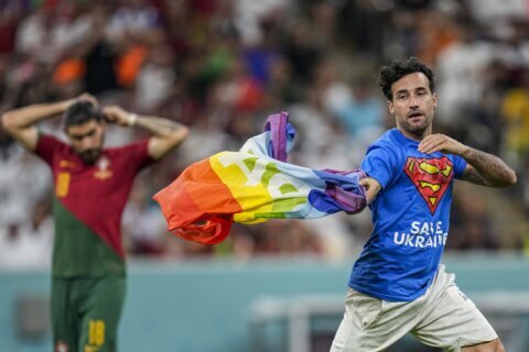 Protestor with rainbow flag runs onto field at World Cup