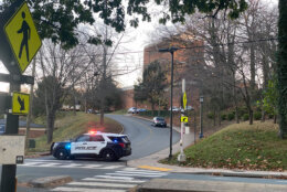 Police cars are seen at the University of Virginia