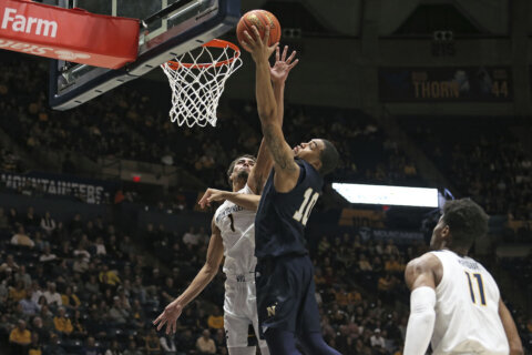 Jones scores 20, leads Navy over Towson 71-69 in overtime