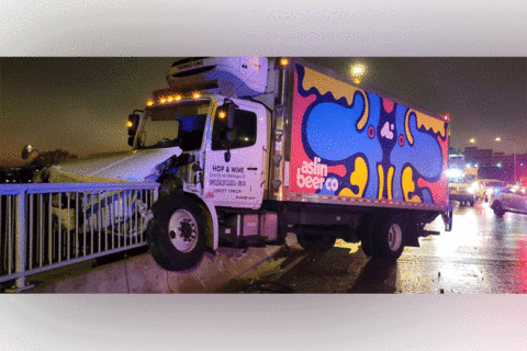 Beer truck hops over Jersey wall on 14th Street Bridge