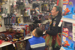 Police go holiday shopping with kids.
