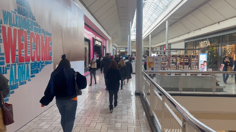 Customers walk around Tysons Corner Center as the post holiday shopping season begins.