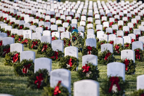 Volunteers honor fallen heroes on Wreaths Across America Day in Arlington