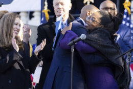 Chelsea Clinton and former Maryland Gov. Martin O'Malley look on as Gov. Wes Moore and Oprah Winfrey hug after Moore is sworn in as the 63rd governor of the state of Maryland, Wednesday, Jan. 18, 2023, in Annapolis, Md. (AP Photo/Julia Nikhinson)