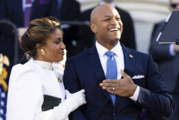 Maryland Gov. Wes Moore and wife, Dawn, embrace after Moore was sworn in as governor, Wednesday, Jan. 18, 2023, in Annapolis, Md. (AP Photo/Julia Nikhinson)