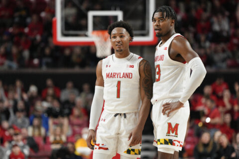 Young sparks Maryland late, knocks off Michigan, 64-58
