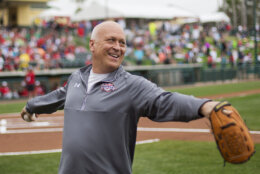 FILE -Former Baltimore Orioles' Cal Ripken Jr., throws the ball around before the start of an exhibition spring training baseball game between the Atlanta Braves an the Washington Nationals, Friday, March 6, 2015, in Kissimmee, Fla. Cal Ripken’s eponymous tournaments for youth baseball players have merged with Cooperstown All Star Village under a new agreement with the owners of the Philadelphia 76ers and New Jersey Devils. Josh Harris and David Blitzer have become majority investors in the deal announced Wednesday, Jan. 18, 2023 that merged two of the leading youth baseball brands that combined to host more 15,000 teams and 250,000 participants last year.(AP Photo/David Goldman, File)