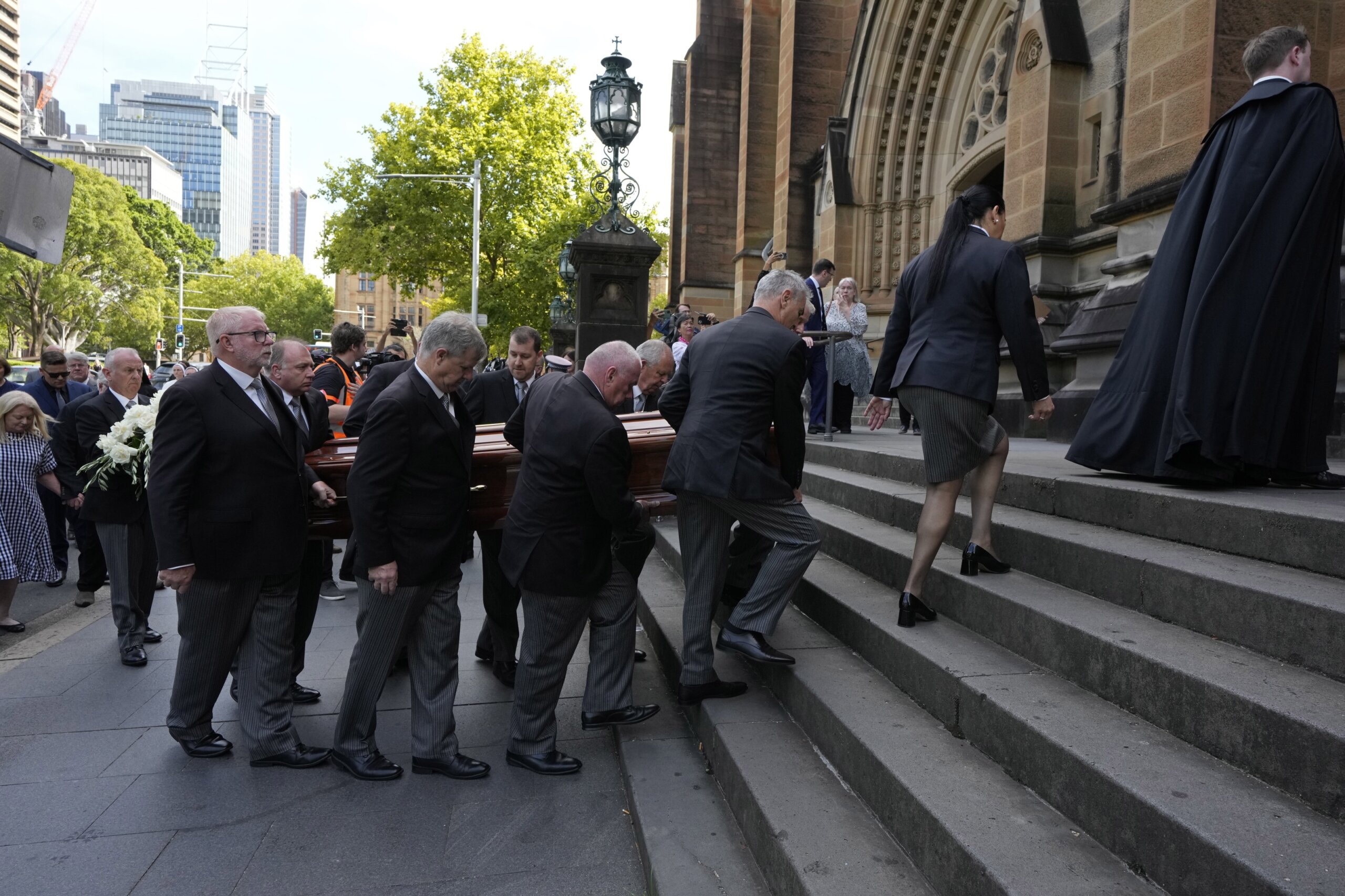Pell mourned at Sydney cathedral day before funeral, protest