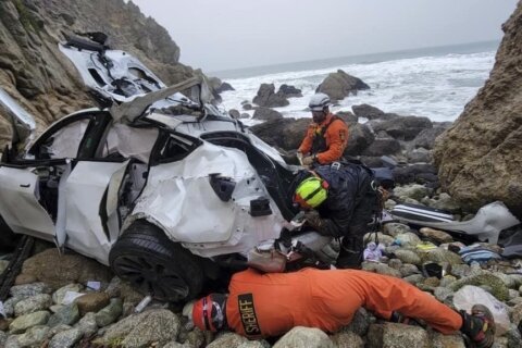 Driver in California cliff crash moved from hospital to jail