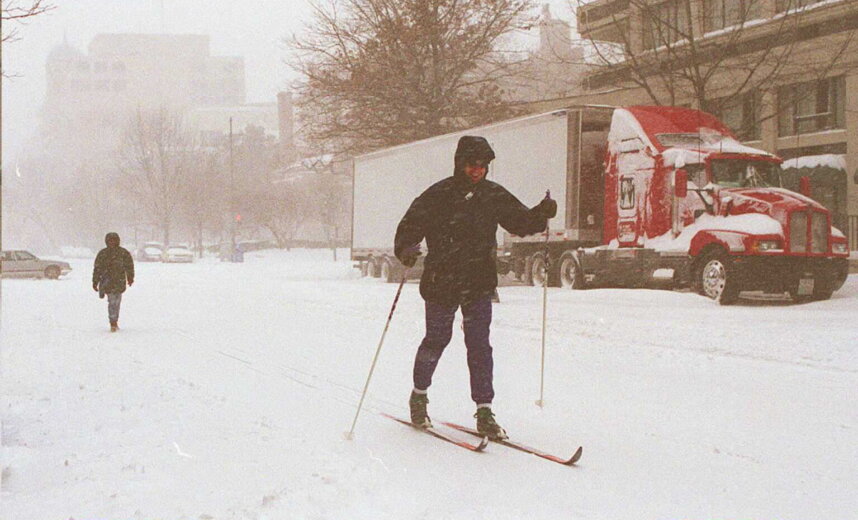 WASHINGTON, DC - JANUARY 7:  Jim Huse of Washington, DC skis along 15 Street, N.W. 07 January in Washington as the first major snow storm of the season hits the east coast.  Washington, DC is expected to get up to two feet of snow as the storm is forecast to continue through the next 24 hours.  AFP  PHOTO    Cyrena CHANG  (Photo credit should read CYRENA CHANG/AFP via Getty Images)