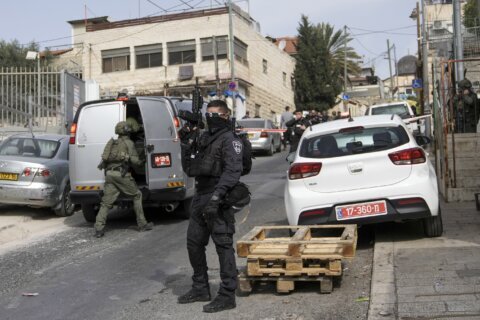 Palestinian gunman wounds 2, day after 7 killed in Jerusalem