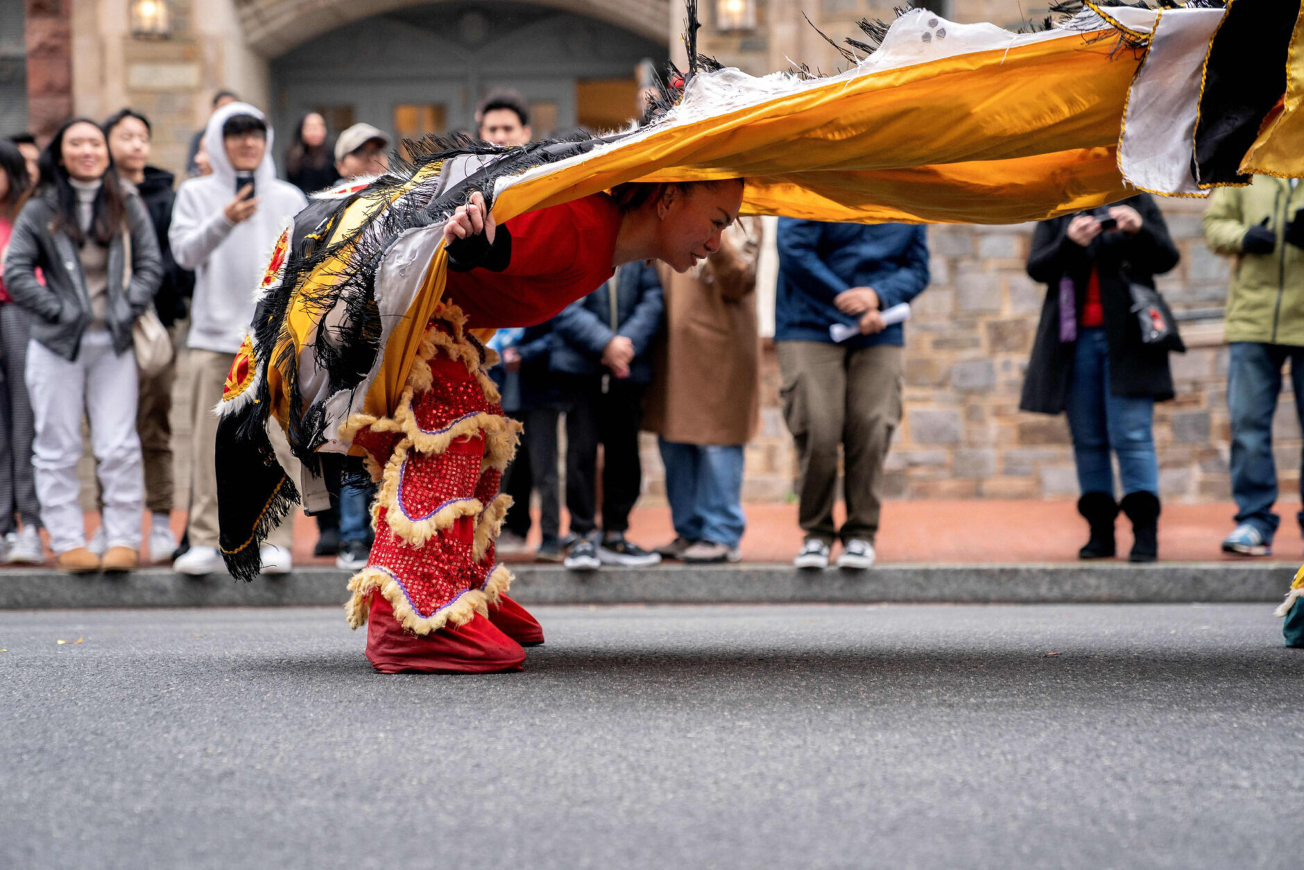 A participant dances during the Lunar New Year Parade in the Chinatown neighborhood of Washington, DC, on January 22, 2023. - 2023 is the year of the rabbit in the Chinese horoscope. (Photo by Stefani Reynolds / AFP) (Photo by STEFANI REYNOLDS/AFP via Getty Images)