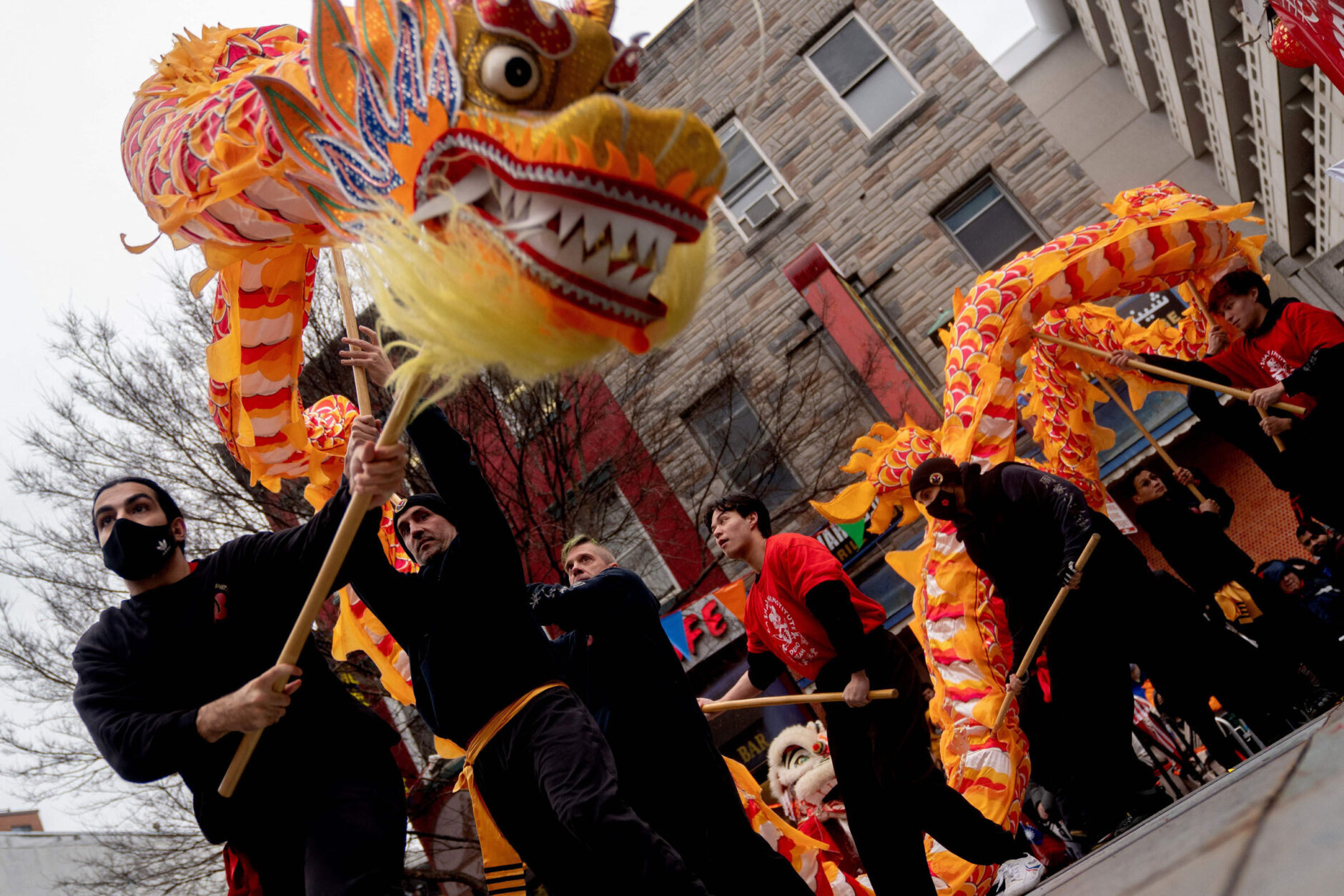 Performers dance on stage following the Lunar New Year Parade in the Chinatown neighborhood of Washington, DC, on January 22, 2023. - 2023 is the year of the rabbit in the Chinese horoscope. (Photo by Stefani Reynolds / AFP) (Photo by STEFANI REYNOLDS/AFP via Getty Images)