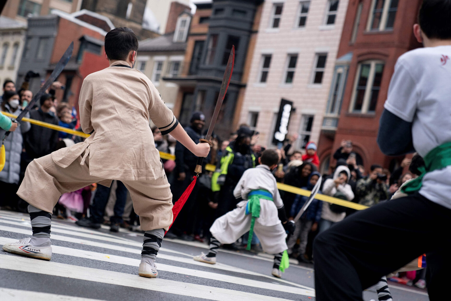 Participants perform during the Lunar New Year Parade in the Chinatown neighborhood of Washington, DC, on January 22, 2023. - 2023 is the year of the rabbit in the Chinese horoscope. (Photo by Stefani Reynolds / AFP) (Photo by STEFANI REYNOLDS/AFP via Getty Images)