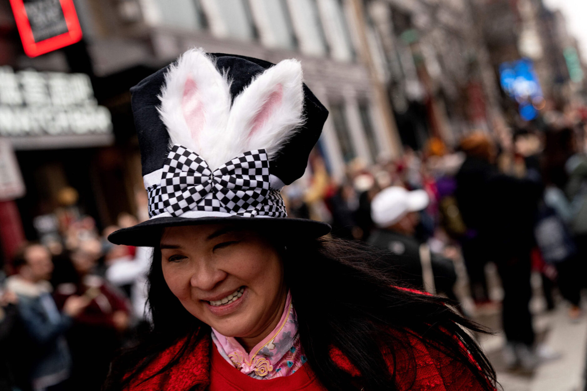 A participant wears rabbit ears during the Lunar New Year Parade in the Chinatown neighborhood of Washington, DC, on January 22, 2023. - 2023 is the year of the rabbit in the Chinese horoscope. (Photo by Stefani Reynolds / AFP) (Photo by STEFANI REYNOLDS/AFP via Getty Images)