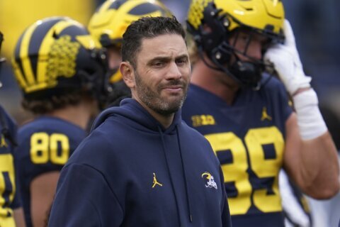 Michigan says it had proof against fired football assistant