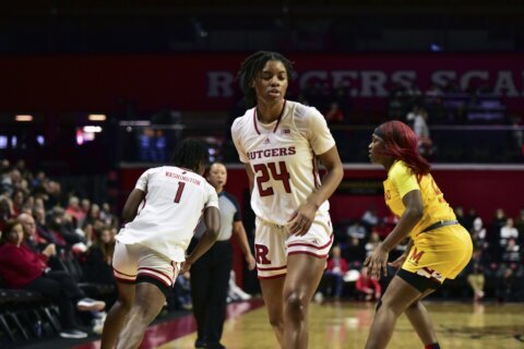 Bloodied Sidibe briefly wears Rutgers coach’s ceremonial uni