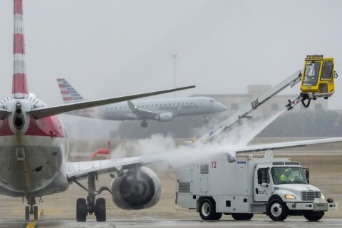 Flights canceled, at least 2 dead as ice storm freezes US